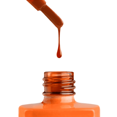A bottle of Apres Gel Color Jelly is being dripped onto a white background.