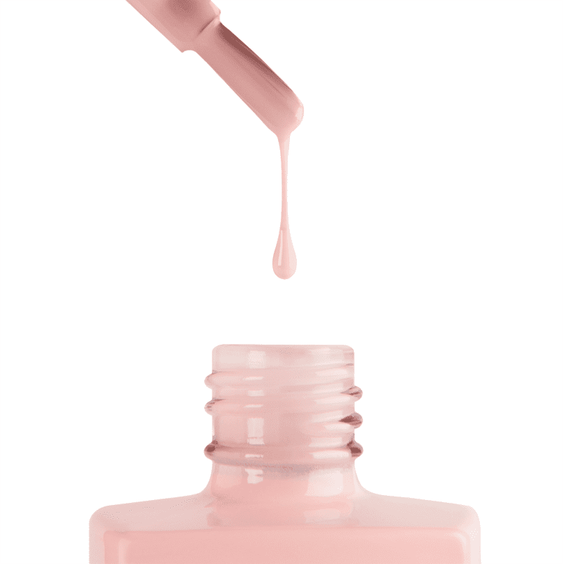 A bottle of apres Gel Color Nude nail polish is being applied onto a white background.