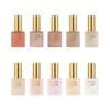 A set of ten bottles of Apres Light & Shadow Sheer Gel Collection 10ml with gold caps, each labeled "Light & Shadow" by Après, featuring a range of colors from dark red to light pink and beige.